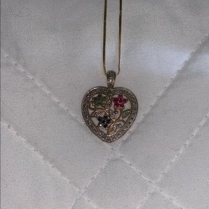 Long gold necklace with heart pendant